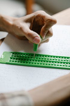 Close-Up Photo of Visually Impaired Writing Materials